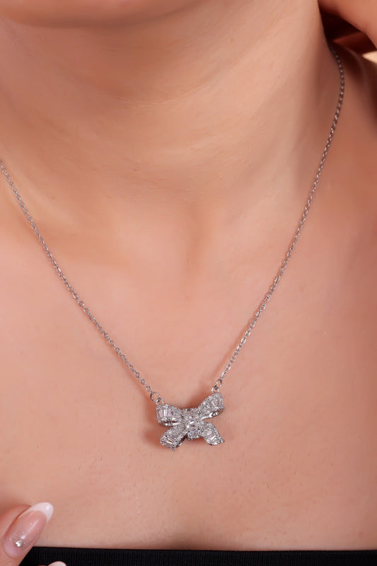 Elegant Silver Bow Pendant Necklace with Sparkling Gemstones – A Timeless Symbol of Grace and Sophistication