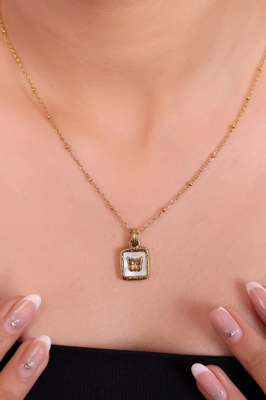 Elegant Gold Butterfly Pendant Necklace with White Enamel Accent – A Symbol of Grace, Transformation, and Timeless Beauty