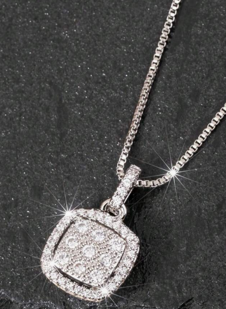 Silver/ Gold/ Rose gold Elegant Diamond Pendant Necklace on Black Textured Background
